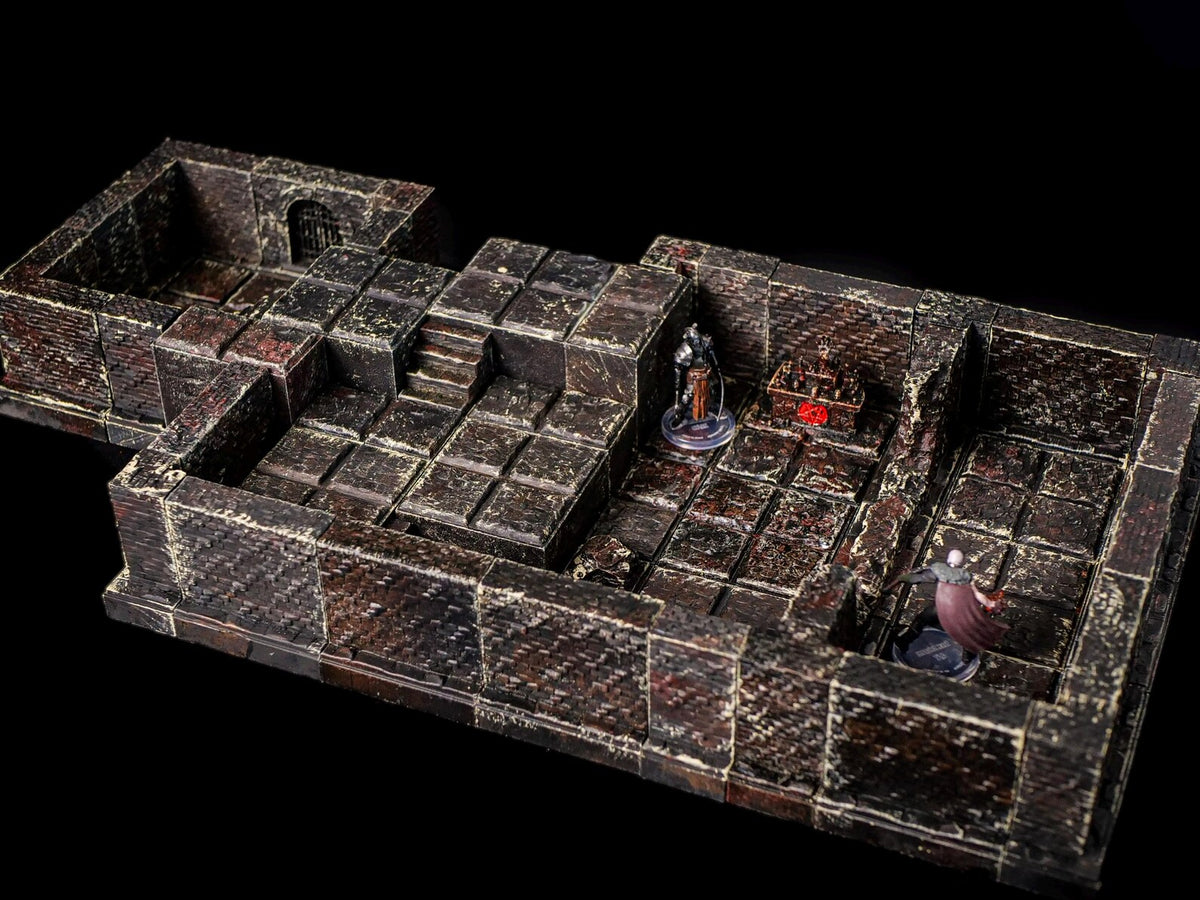 A detailed, modular dungeon terrain set, featuring brick-textured walls and floors. The set includes stairs, doorways, and miniature figurines, creating a realistic environment for tabletop gaming. The color palette is primarily dark brown and gray.
