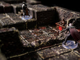 A detailed tabletop gaming scene featuring a dungeon setting with stone tiles and miniature figures. The environment is dark and textured, with a focus on the game's immersive design. The figures are in action poses, enhancing the game's narrative.