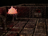 A miniature metal brazier with a glowing pink and orange flame insert, positioned on a dark, textured stone-like floor within a dungeon-themed setting featuring brick walls and a stone archway in the background.