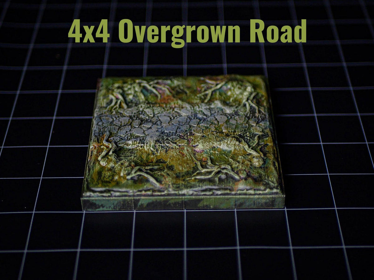 A square game tile featuring a textured, stone-like path surrounded by green, mossy terrain with raised root details. The text 4x4 Overgrown Road is printed in light green above the tile, which sits on a black grid surface.