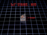 A miniature set of stairs with a stone-like texture and dark grey and brown coloring. The object is labeled 1x1" STAIRS - MID and 1" HEIGHT, indicating a 1-inch height measurement on a black grid background for tabletop gaming.
