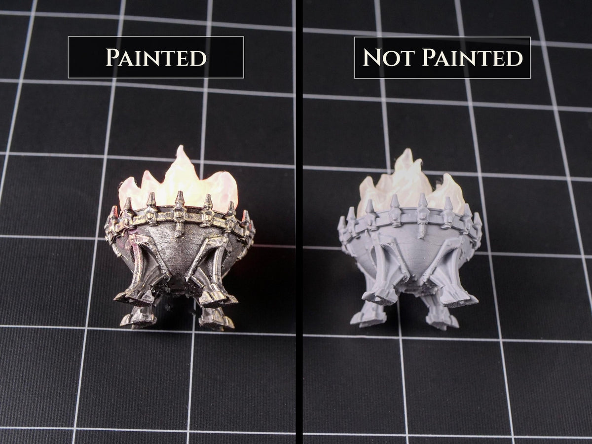 A miniature brazier with a flame insert, shown in two versions: one painted metallic silver with a glowing orange flame, and one unpainted gray resin. The text labels read "PAINTED" and "NOT PAINTED" above each respective item.