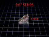 A miniature staircase model with a textured stone brick pattern in shades of brown and grey. The piece is labeled 2x1" STAIRS and 2" HEIGHT, indicating its dimensions. The structure features five steps leading to a flat top landing.